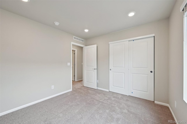 unfurnished bedroom with carpet floors, baseboards, and recessed lighting
