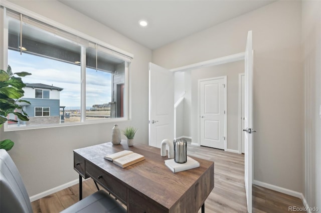 home office featuring wood finished floors and baseboards