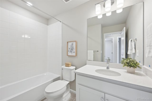 bathroom with washtub / shower combination, toilet, vanity, and tile patterned flooring