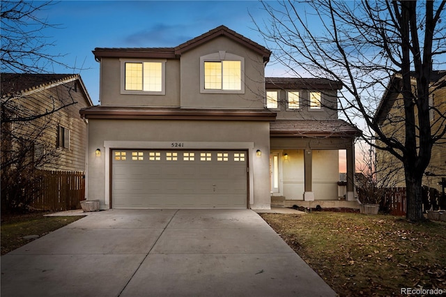 view of front of property with a garage