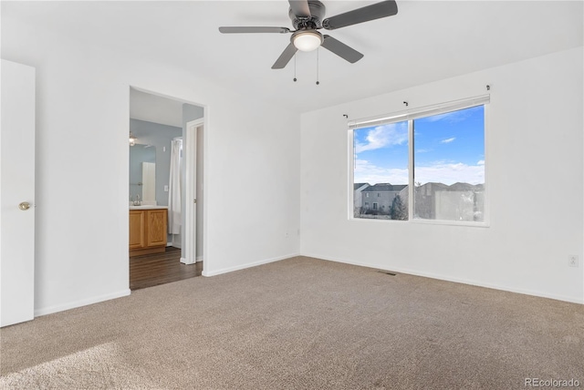 5241 S Shawnee St, Aurora, CO 80015 - unfurnished bedroom with carpet, ensuite bath, and a ceiling fan