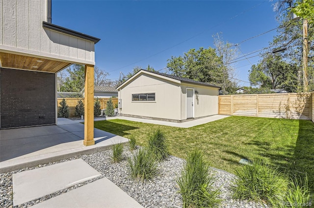 view of yard with a patio and an outdoor structure