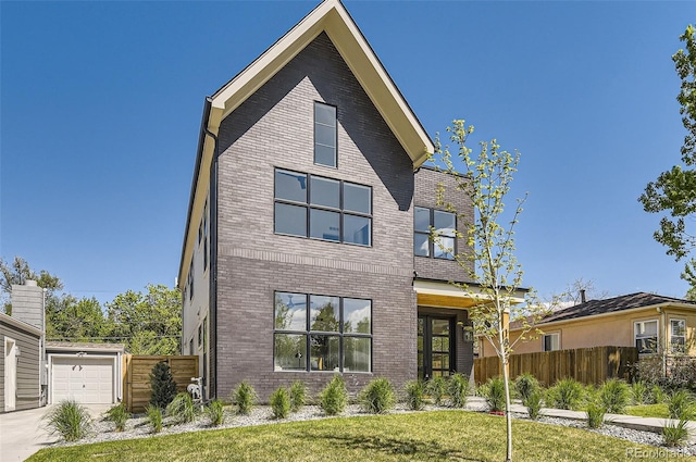 contemporary home with brick siding and driveway