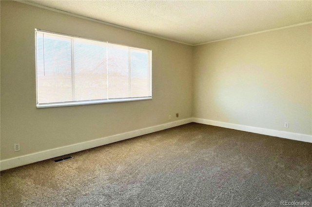 carpeted spare room with crown molding