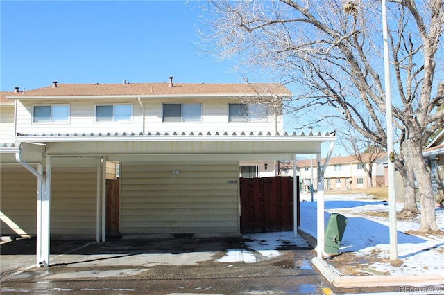 view of front of property with a carport