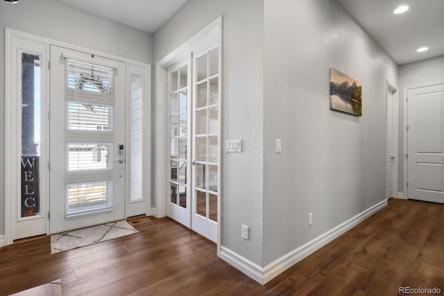 doorway to outside featuring recessed lighting, baseboards, and dark wood-style floors