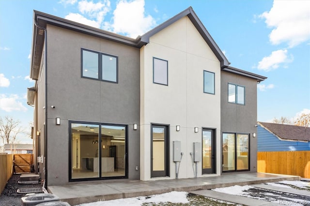 back of property with a patio area