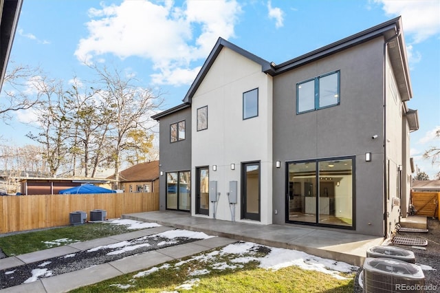 back of house featuring central AC unit and a patio