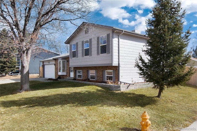 split level home with a garage and a front lawn