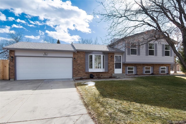 tri-level home with a garage and a front lawn