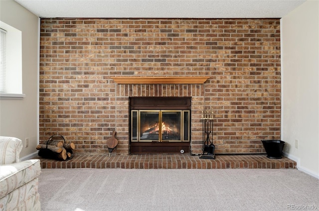 details featuring a fireplace, carpet, and a textured ceiling