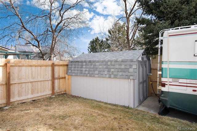 view of outdoor structure featuring a lawn