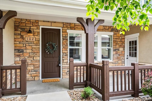 5850 Dripping Rock Ln Unit G102, Fort Collins, CO 80528 - view of exterior entry with a porch and stone siding