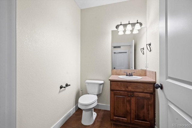 5850 Dripping Rock Ln Unit G102, Fort Collins, CO 80528 - bathroom featuring vanity, toilet, and baseboards