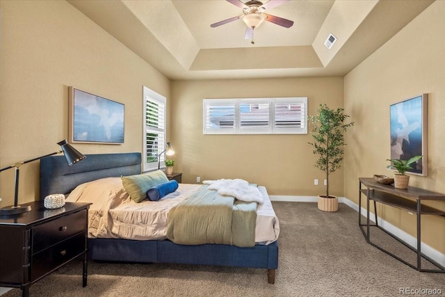 5850 Dripping Rock Ln Unit G102, Fort Collins, CO 80528 - bedroom with carpet flooring, a tray ceiling, baseboards, and ceiling fan