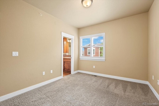 5850 Dripping Rock Ln Unit G102, Fort Collins, CO 80528 - unfurnished room featuring carpet and baseboards
