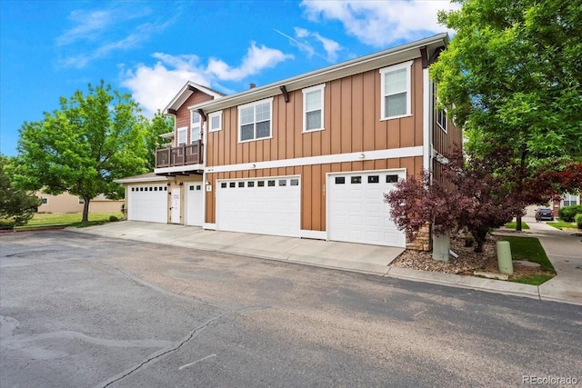 5850 Dripping Rock Ln Unit G102, Fort Collins, CO 80528 - view of front of home featuring a garage, board and batten siding, and driveway