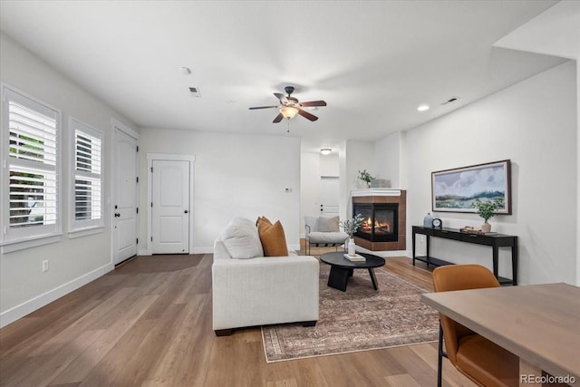 5850 Dripping Rock Ln Unit G102, Fort Collins, CO 80528 - living area featuring a ceiling fan, wood finished floors, a fireplace, baseboards, and recessed lighting