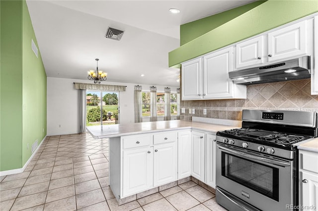465 W Palmer Lake Dr, Pueblo, CO 81007 - kitchen featuring stainless steel range with gas stovetop, under cabinet range hood, a peninsula, light countertops, and a chandelier