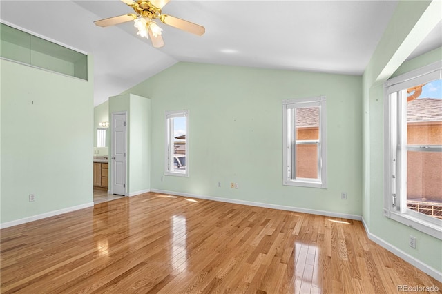 465 W Palmer Lake Dr, Pueblo, CO 81007 - unfurnished living room with lofted ceiling, light wood-style flooring, plenty of natural light, and ceiling fan