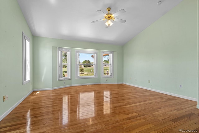 465 W Palmer Lake Dr, Pueblo, CO 81007 - unfurnished room featuring vaulted ceiling, ceiling fan, wood finished floors, and baseboards