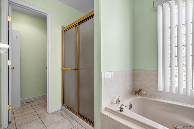 465 W Palmer Lake Dr, Pueblo, CO 81007 - bathroom featuring tile patterned floors, a bath, and a shower stall