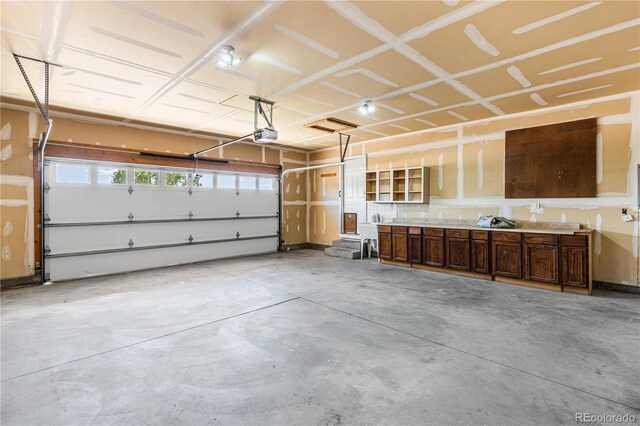 465 W Palmer Lake Dr, Pueblo, CO 81007 - garage featuring a garage door opener