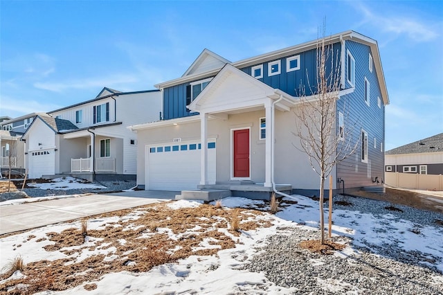 3899 N Shaenee St, Aurora, CO 80019 - view of front facade featuring a garage, concrete driveway, and board and batten siding