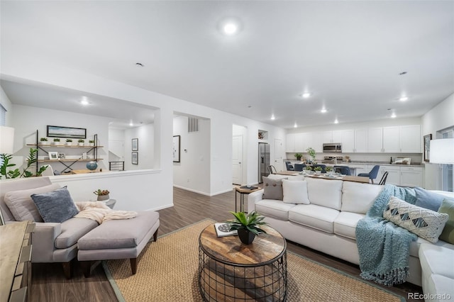 3899 N Shaenee St, Aurora, CO 80019 - living room with dark wood-type flooring, recessed lighting, and baseboards