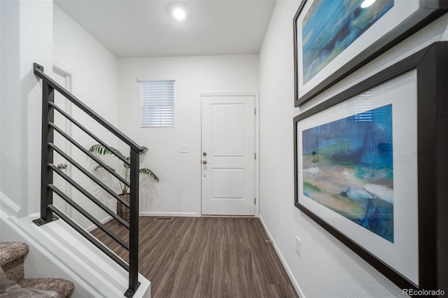 3899 N Shaenee St, Aurora, CO 80019 - foyer with stairway, dark wood finished floors, and baseboards