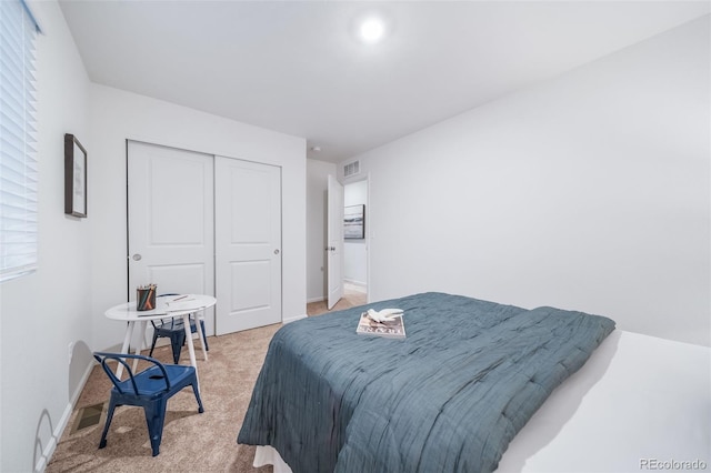 3899 N Shaenee St, Aurora, CO 80019 - bedroom featuring light colored carpet, a closet, and baseboards