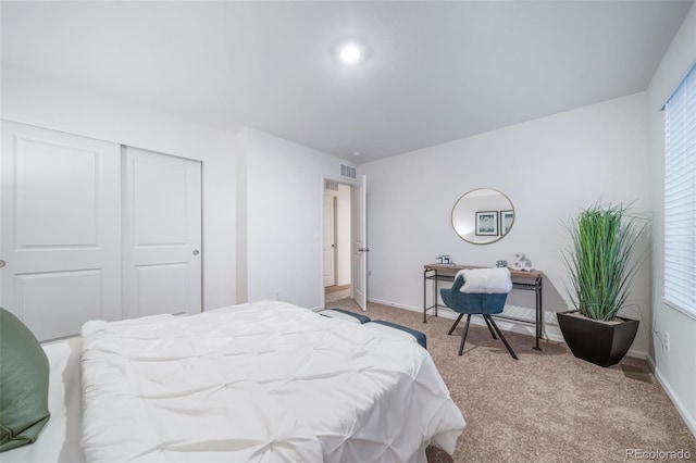 3899 N Shaenee St, Aurora, CO 80019 - bedroom featuring a closet, light colored carpet, and baseboards