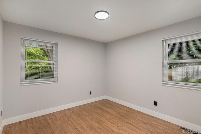 10051 E Walsh Pl, Denver, CO 80247 - empty room featuring baseboards and light wood-style flooring