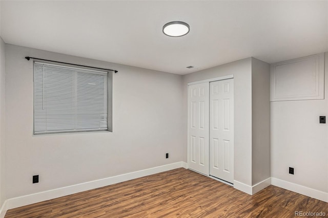 10051 E Walsh Pl, Denver, CO 80247 - unfurnished bedroom with wood finished floors and a closet