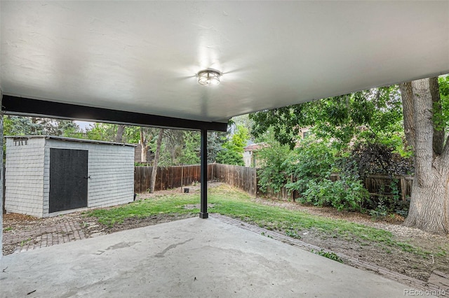 10051 E Walsh Pl, Denver, CO 80247 - fenced backyard featuring a patio area and a storage shed