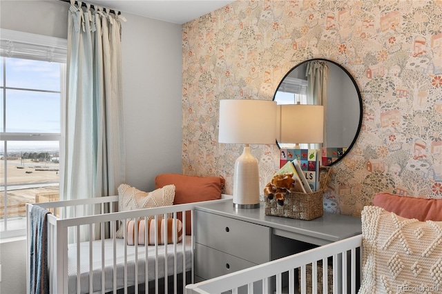 bedroom with wallpapered walls
