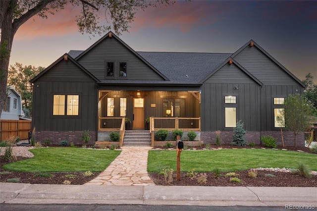 view of front of house featuring a yard and a porch