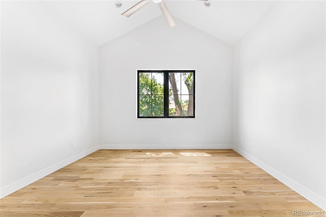 unfurnished room with light hardwood / wood-style floors, vaulted ceiling with beams, and ceiling fan