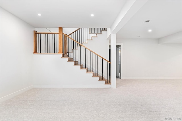 staircase with carpet floors