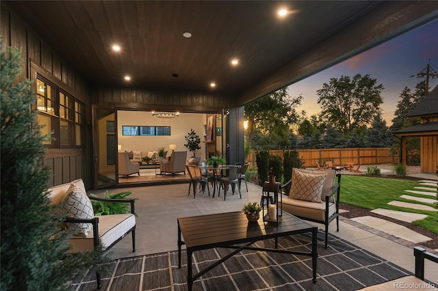 patio terrace at dusk with outdoor lounge area