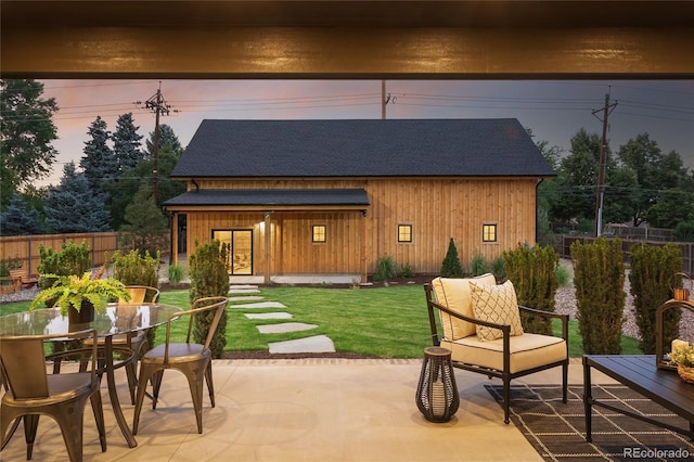 patio terrace at dusk with a yard