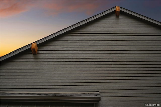 view of property exterior at dusk