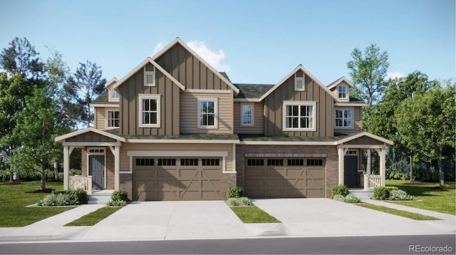 view of front of property featuring concrete driveway, a front lawn, a garage, board and batten siding, and brick siding