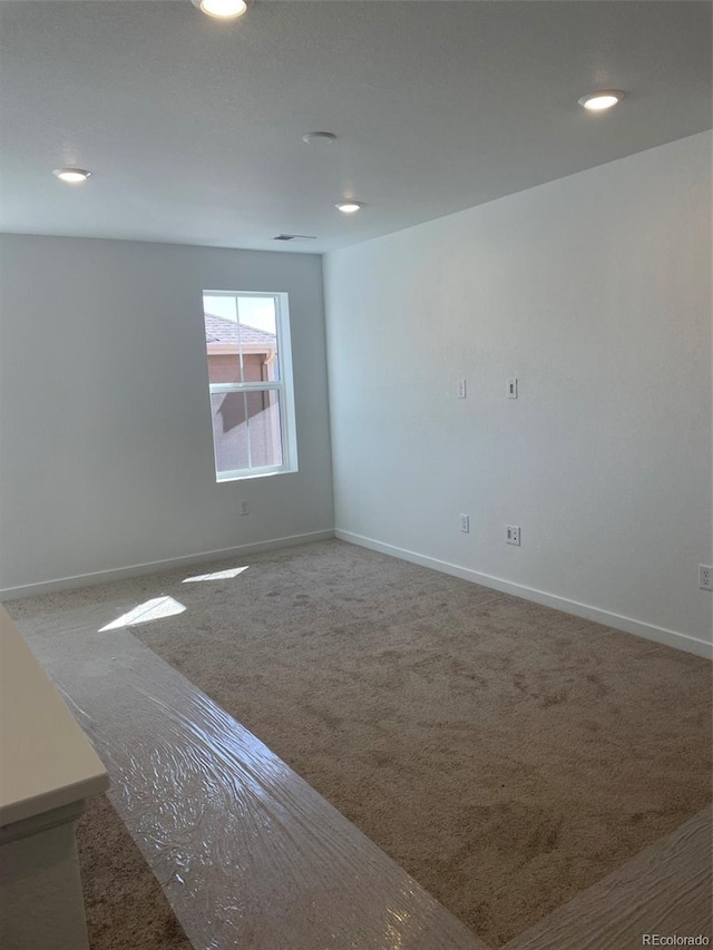 6750 Juniper Dr, Thornton, CO 80602 - carpeted empty room featuring recessed lighting and baseboards