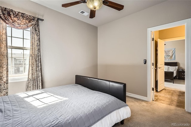 bedroom with visible vents, ceiling fan, light carpet, and baseboards