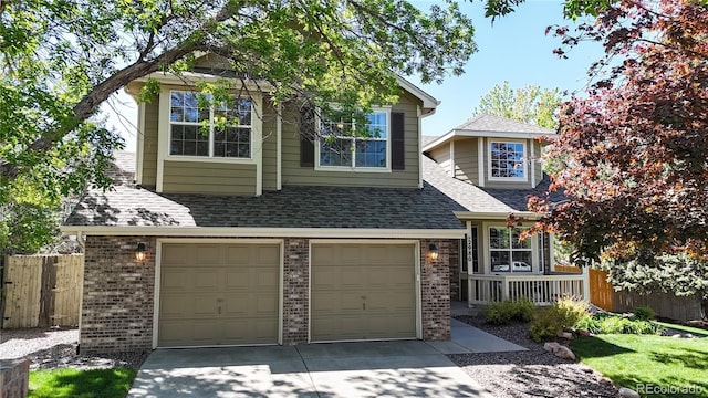 view of front of house featuring fence, brick siding, driveway, an attached garage, and roof with shingles