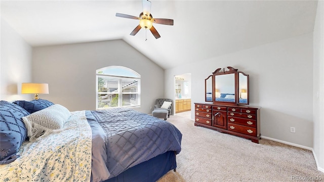 carpeted bedroom with lofted ceiling, ceiling fan, ensuite bathroom, and baseboards