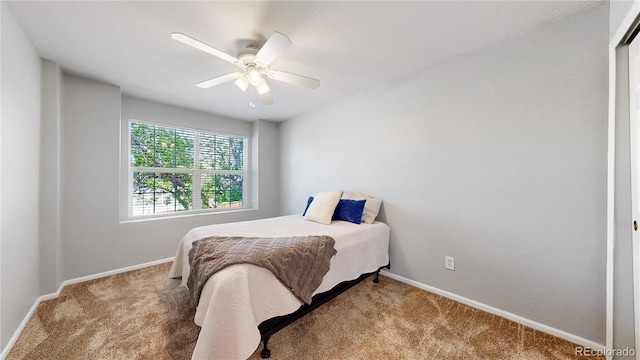 bedroom featuring carpet, baseboards, and ceiling fan