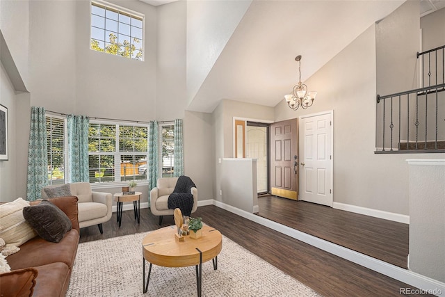 2980 E 135th Dr, Thornton, CO 80241 - living room with a towering ceiling, wood finished floors, a chandelier, and plenty of natural light