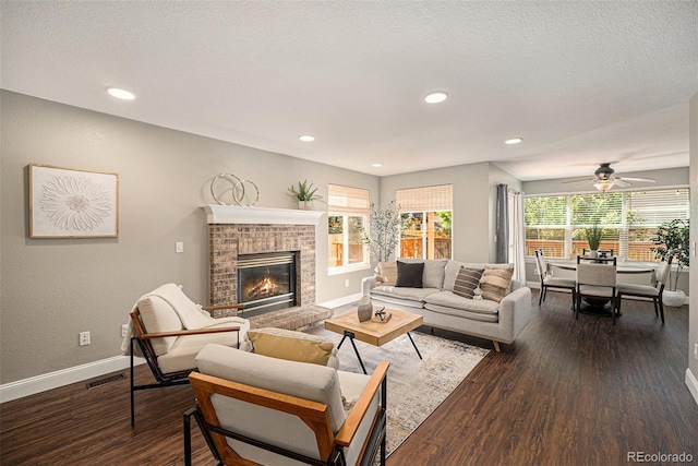 2980 E 135th Dr, Thornton, CO 80241 - living area with dark wood-type flooring, a fireplace, ceiling fan, and recessed lighting